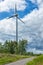 Wind turbines in the forest with blue sky. Ecological power concept