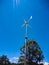 Wind turbines in the forest. Wind generators turbines in wild. Small wind turbine with sky, renewable energy source of future -