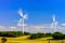 Wind turbines generating electricity in windfarm