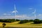 Wind turbines generating electricity in windfarm