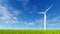 Wind turbines on a green grass field 4K