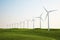 Wind turbines on green grass field