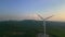 Wind turbines on hilltop in picturesque natural landscape