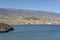 Wind turbines lining the southern coast of the island, alternative source of energy in El Poris de Abona, Tenerife