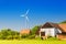 Wind turbines located on farm land near crop field