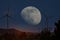 Wind turbines in moonlight in a landscape with clear skies