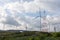 Wind turbines on the mountain and beautiful view after raining with giant cloudy flow and sun shy at khao kho,phetchabun