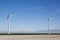 Wind turbines near the dike along the dutch Waddenzee