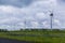 Wind turbines next to a motorway in a rural area in the Netherlands