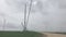 Wind turbines park and construction site, pan from right to left