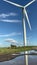 Wind turbines that produce electricity energy. Windmill Wind power technology productions Wind turbines in field