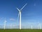 Wind turbines that produce electricity energy. Windmill Wind power technology productions Wind turbines in field