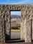 Wind turbines seen through stone door way