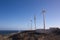 Wind turbines in series next to the sea