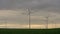 Wind Turbines Slowly Rotating In Sunset