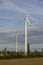 Wind turbines or windmills generating electricity. Renewable electric energy production.
