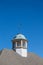 Wind Vane on Cupola Under Clear Blue Sky