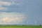 Wind warm on agricultural ground with cloudy sky in background