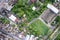 Winding asphalt road among plantation and commercial building in suburban at countryside