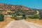 winding Asphalt road with a view of a lonely rocky mountain in the countryside area in Turkey