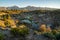 Winding bubbling river at Hot Creek Geological Site in Mammoth Lakes California, with the Eastern Sierra Nevada mountains in