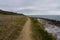 Winding coastal footpath towards Oxwich Bay