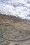 Winding curvy rural road with light trail from headlights leading through Ladakh in India