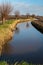 Winding ditch in a Dutch polder landscape