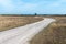 Winding gravel road in a barren landscape