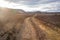 Winding gravel road through Odaddahraun lava field Highlands of Iceland Scandinavia