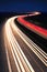 Winding Motorway at night, long exposure of headlights and taillights in blurred motion