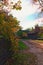 Winding narrow dirt village road. Picturesque landscape of ancient Ukrainian village