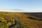 Winding path from Higger tor, across the slopes of Burbage Valley