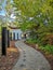 Winding pathway made of gemstones leading to a Chinese pavilion and the large aviary in the zoo Pairi Daiza