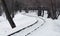 The winding railway. Snowy railroad tracks