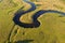 Winding river, aerial view. Summer landscape, top view. A green valley with a winding riverbed