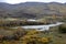 A winding river in autumn grasslands