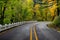 A winding road along the Columbia River Scenic Byway with the classic white fencing in Oregon