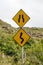 Winding road and bottleneck signs