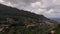 Winding road leading along green mountains