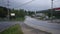 Winding road leading over bridge of small generic american town