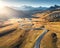 Winding road in mountain valley at sunset in autumn. Aerial view