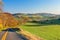 Winding Road Snakes Through Autumn Countryside