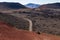 Winding road snaking through a picturesque mountainous valley. Lanzarote, Canary Islands.