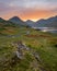 Winding Single Track Road Leading Through Green Secluded Countryside With Beautiful Sunrise. Wastwater, Lake District, UK.