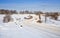 Winding snow-covered road through the bridge