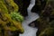 Winding stream in Glacier with mossy rocks