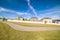 Winding walkway through a grassed park during day