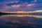 On this almost windless evening the last boats sail back to the harbor and the just set sun creates beautiful colors in the sky