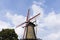 Windmill, birds and blue sky